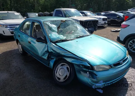 1999 Toyota Corolla Ce из США, поврежденный, VIN 2T1BR12E6XC134802